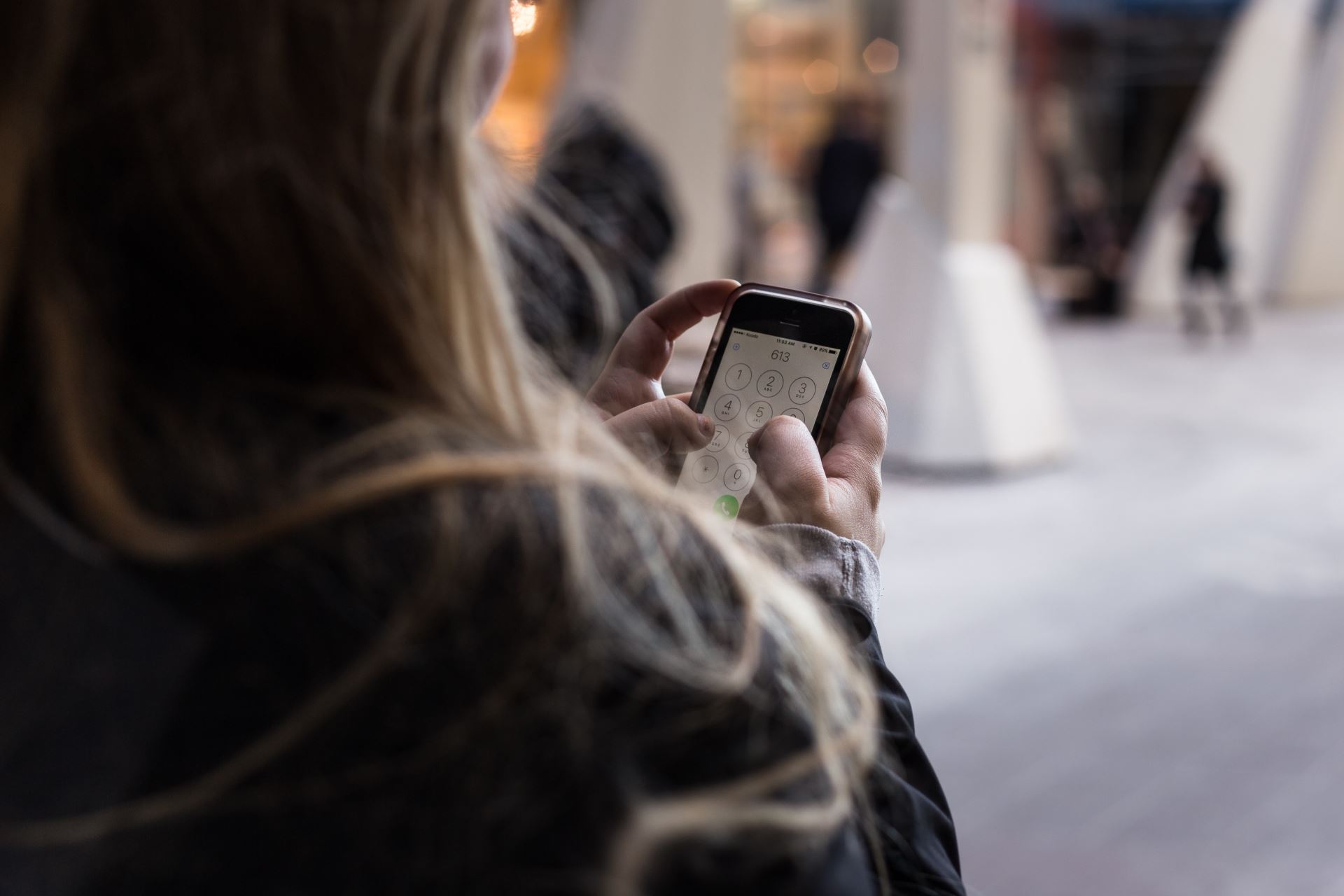 woman dialling phone number